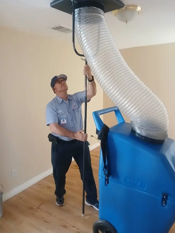 Furnace Tune-Up technician using HEPA equipment in Temple Terrace